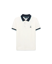Kids' Klaus Pique Polo in cream, a classic fit pique knit shirt with a navy collar and cuffs accented by light blue stripes, featuring a small embroidered Psycho Bunny skull logo on the left chest. (5)