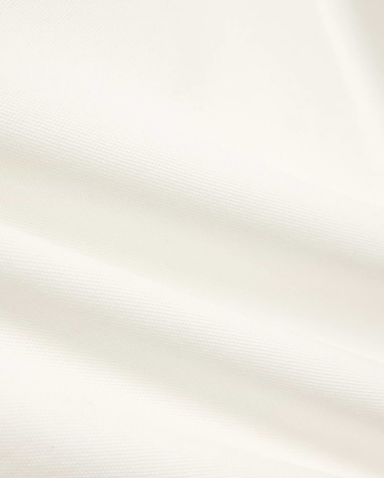 Kids' Klaus Pique Polo, a premium off-white polo featuring the distinctive textured pique fabric with elegant folds, reflecting Psycho Bunny's refined streetwear. (6)