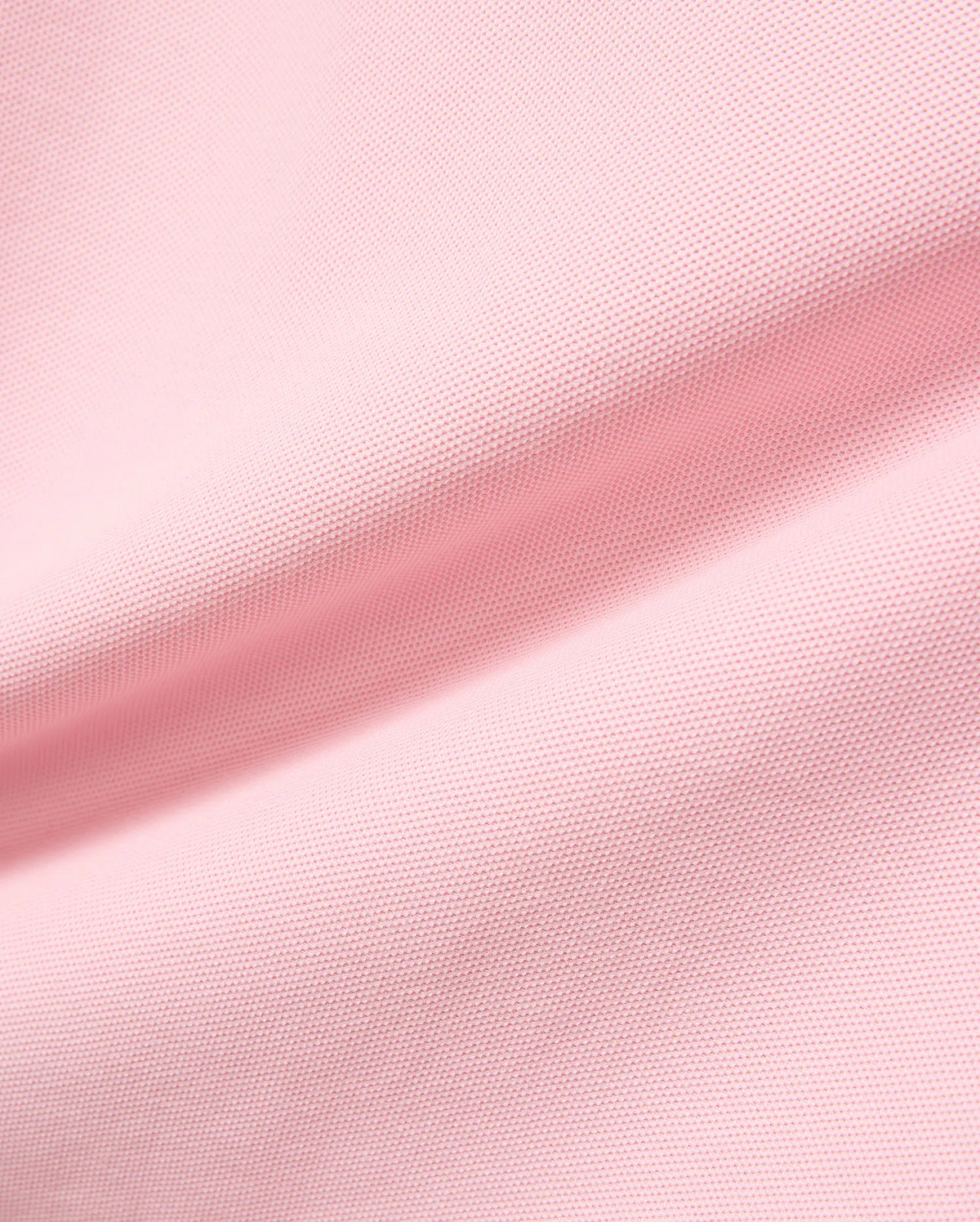 Kids Robin Pique Polo in vibrant pink, crafted from breathable pique fabric, featuring the signature embroidered Psycho Bunny skull logo on the chest, embodying refined streetwear style.