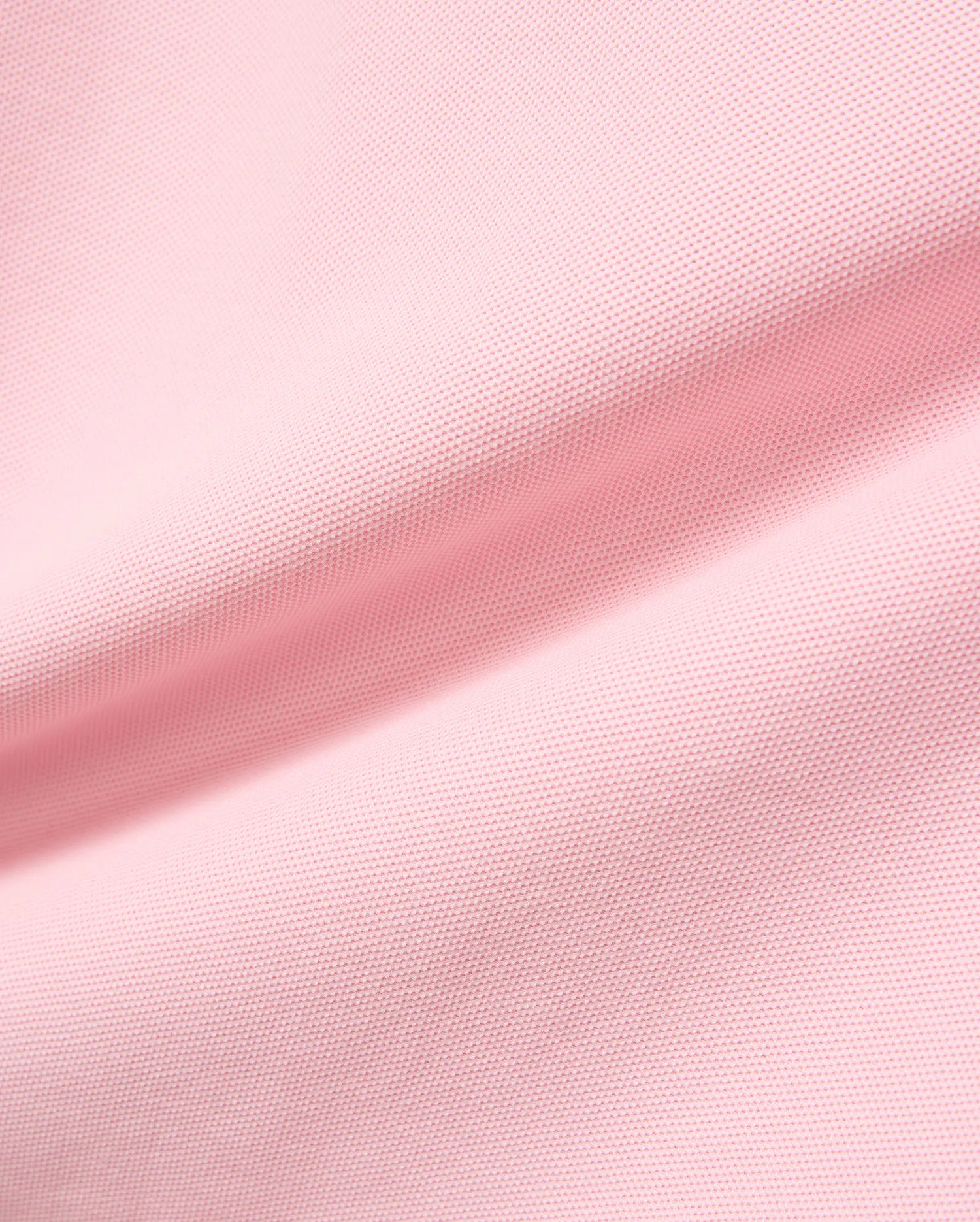 Kids Robin Pique Polo in vibrant pink, crafted from breathable pique fabric, featuring the signature embroidered Psycho Bunny skull logo on the chest, embodying refined streetwear style.