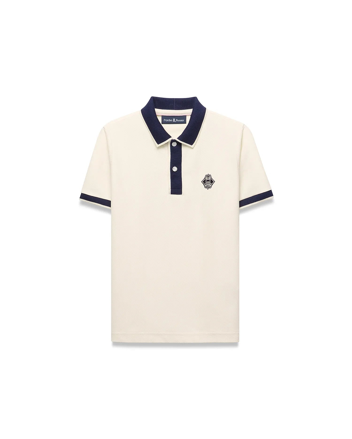 Kids Robin Pique Polo in cream pique fabric with a navy blue collar, placket, and sleeve cuffs, featuring a classic fit and an embroidered Psycho Bunny skull logo on the left chest.