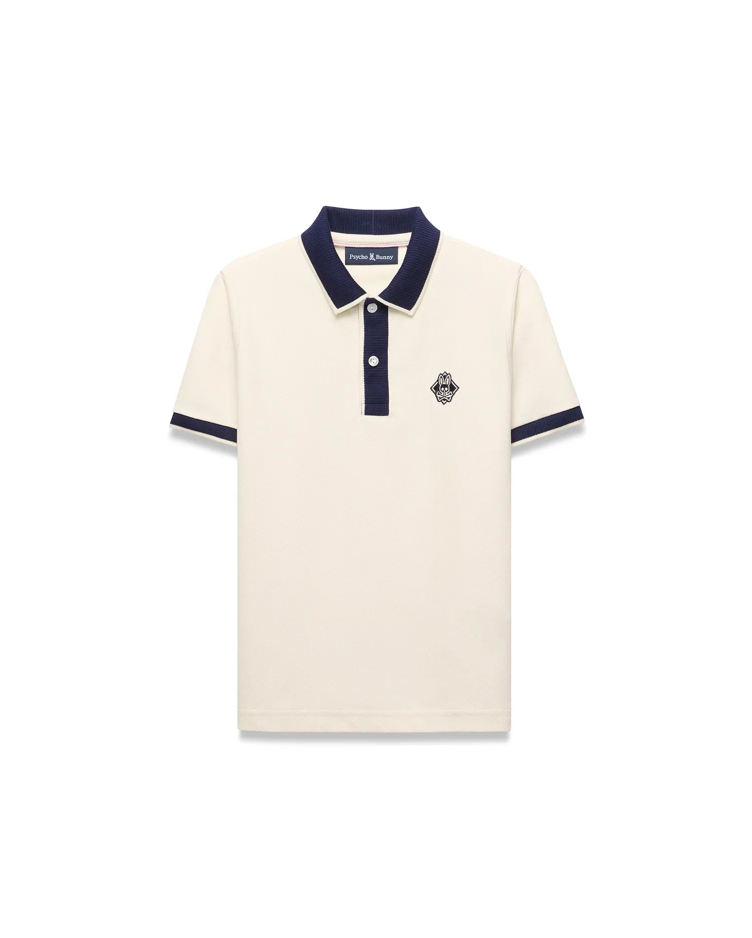 Kids Robin Pique Polo in cream pique fabric with a navy blue collar, placket, and sleeve cuffs, featuring a classic fit and an embroidered Psycho Bunny skull logo on the left chest.