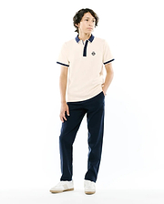 Kids Robin Pique Polo in cream pique with navy blue ribbed collar, two-button placket, and cuffs. Features a small embroidered Psycho Bunny skull logo on the left chest, classic fit.