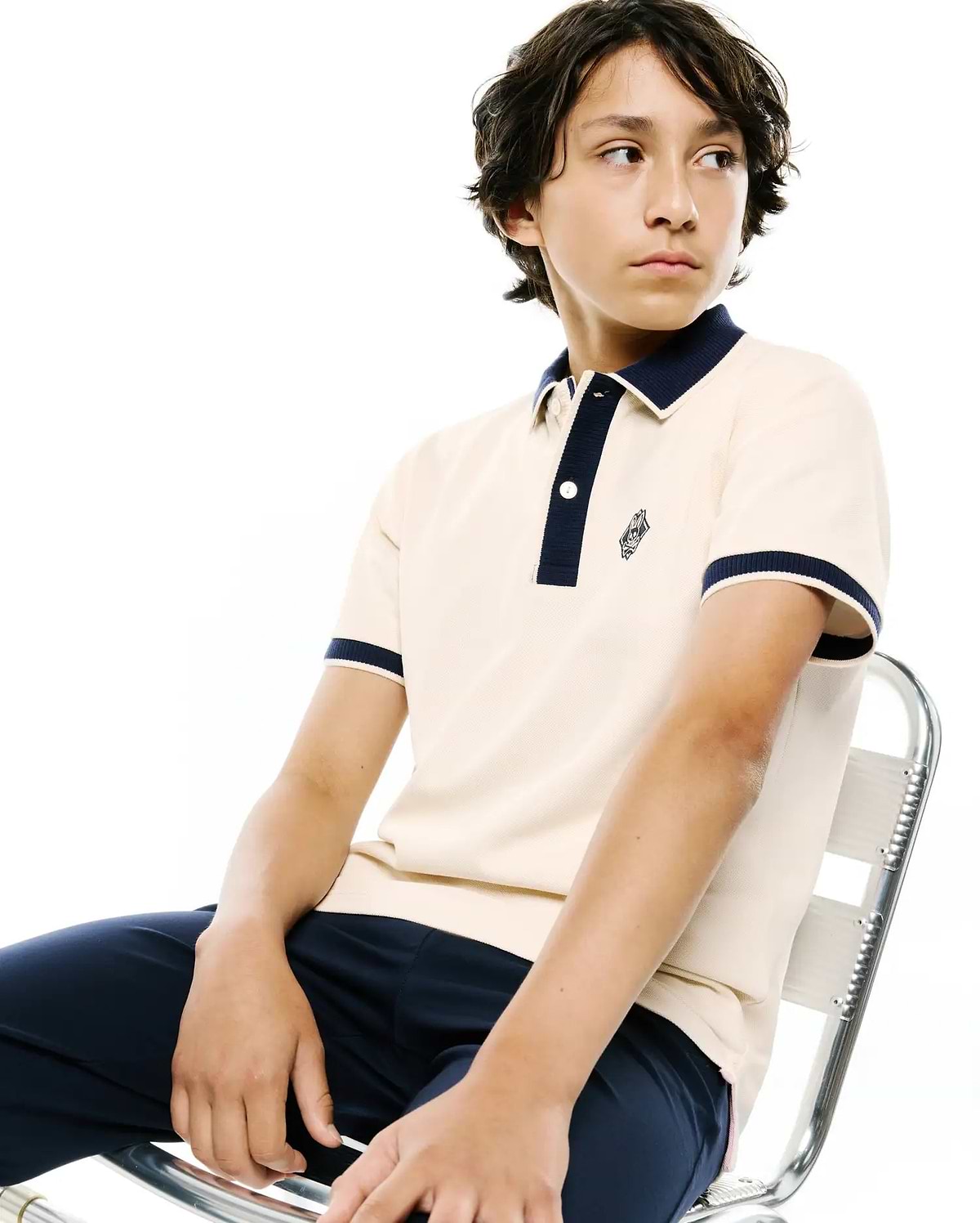 Kids Robin Pique Polo in cream, featuring a classic fit, navy ribbed collar and cuffs, two-button placket, and a small embroidered Psycho Bunny skull logo on the left chest.