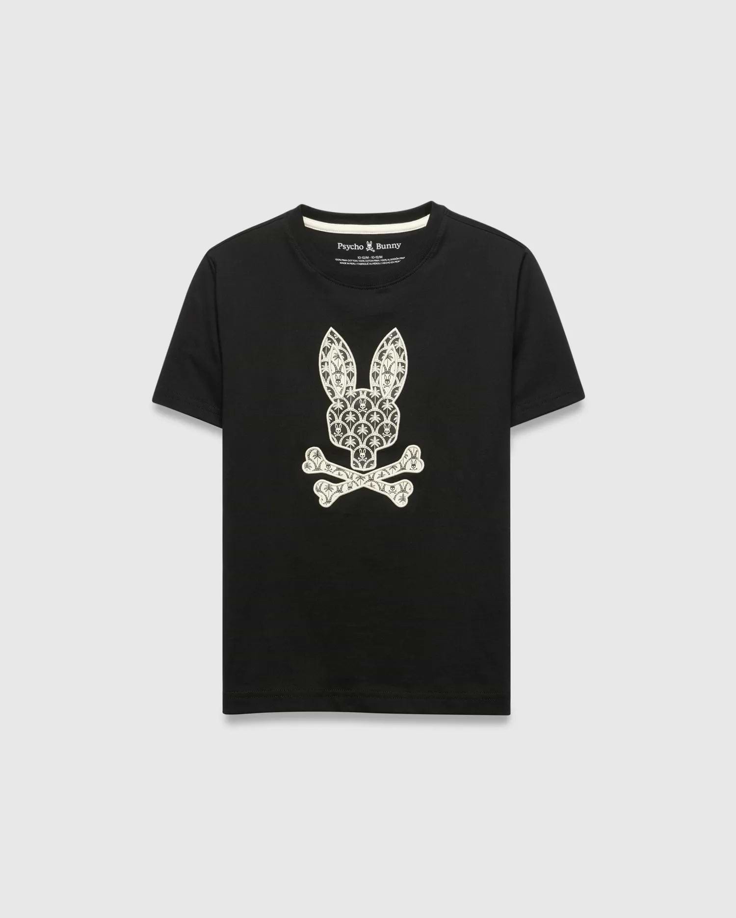 Kids Brad Graphic Tee, black jersey t-shirt with a large white Psycho Bunny skull and crossbones graphic on the chest, featuring a pattern of small bunny logos and palm trees. Classic fit.