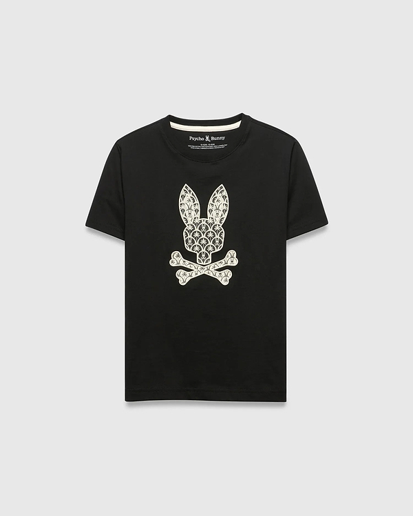 Kids Brad Graphic Tee, black jersey t-shirt with a large white Psycho Bunny skull and crossbones graphic on the chest, featuring a pattern of small bunny logos and palm trees. Classic fit.