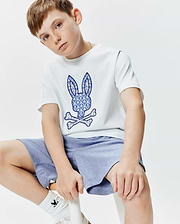 White Kids Brad Graphic Tee, classic fit jersey, with a large blue and white palm tree patterned Psycho Bunny skull and crossbones logo on the center chest.