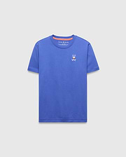 Kids Sunny Chest Graphic Tee, a vibrant blue classic fit jersey t-shirt featuring a small embroidered Psycho Bunny skull logo with sunglasses on the left chest and orange inner collar trim.