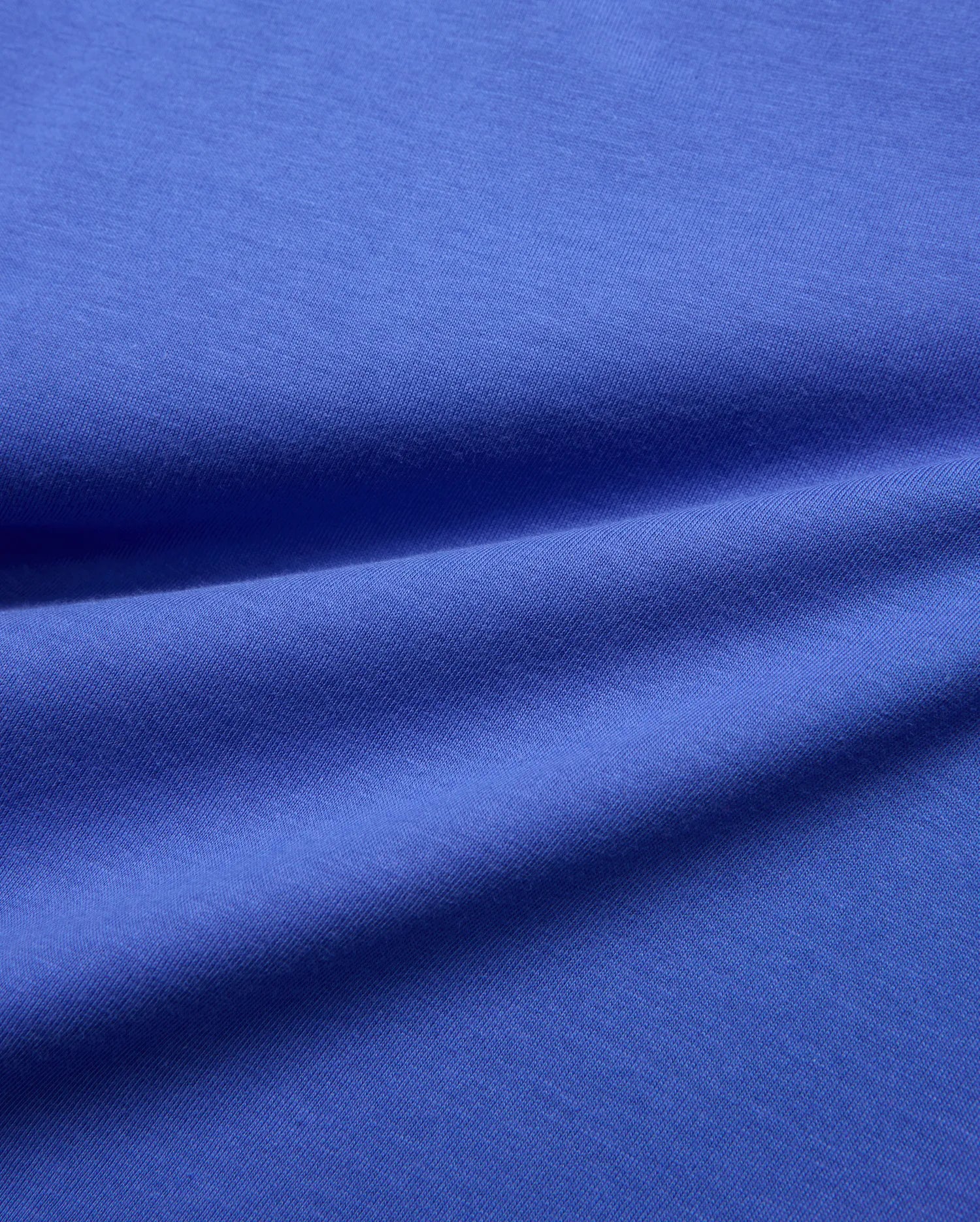Vibrant blue jersey knit fabric swatch, smooth and subtly textured, for the Kids Sunny Chest Graphic Tee, designed for a comfortable, classic fit.