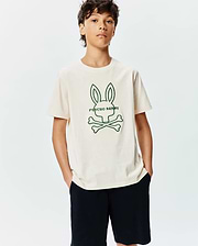 Kids Craig Graphic Tee in cream jersey, featuring a large central green outline of the iconic Psycho Bunny skull and crossbones logo with PSYCHO BUNNY text, in a classic fit.