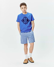 Kids Tobias Graphic Tee in royal blue jersey with a large dark blue Psycho Bunny skull and crossbones diamond graphic on the chest, paired with heather light blue jersey shorts.