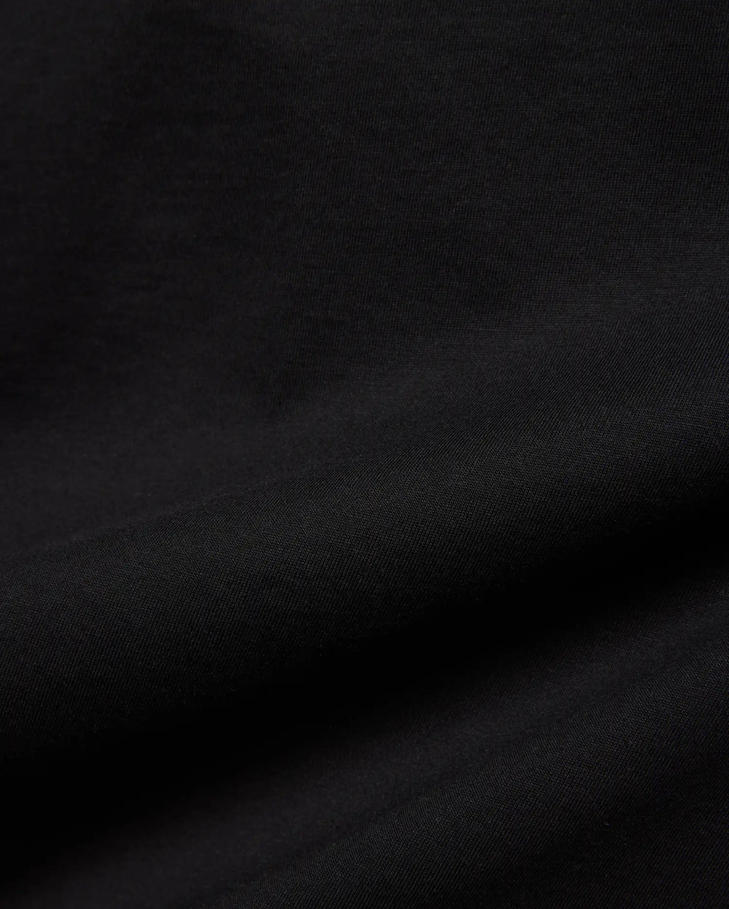 Kids Isaac Relaxed Fit Tee in deep black, crafted from a premium, soft jersey knit fabric with a subtle, comfortable texture, perfect for refined streetwear style.