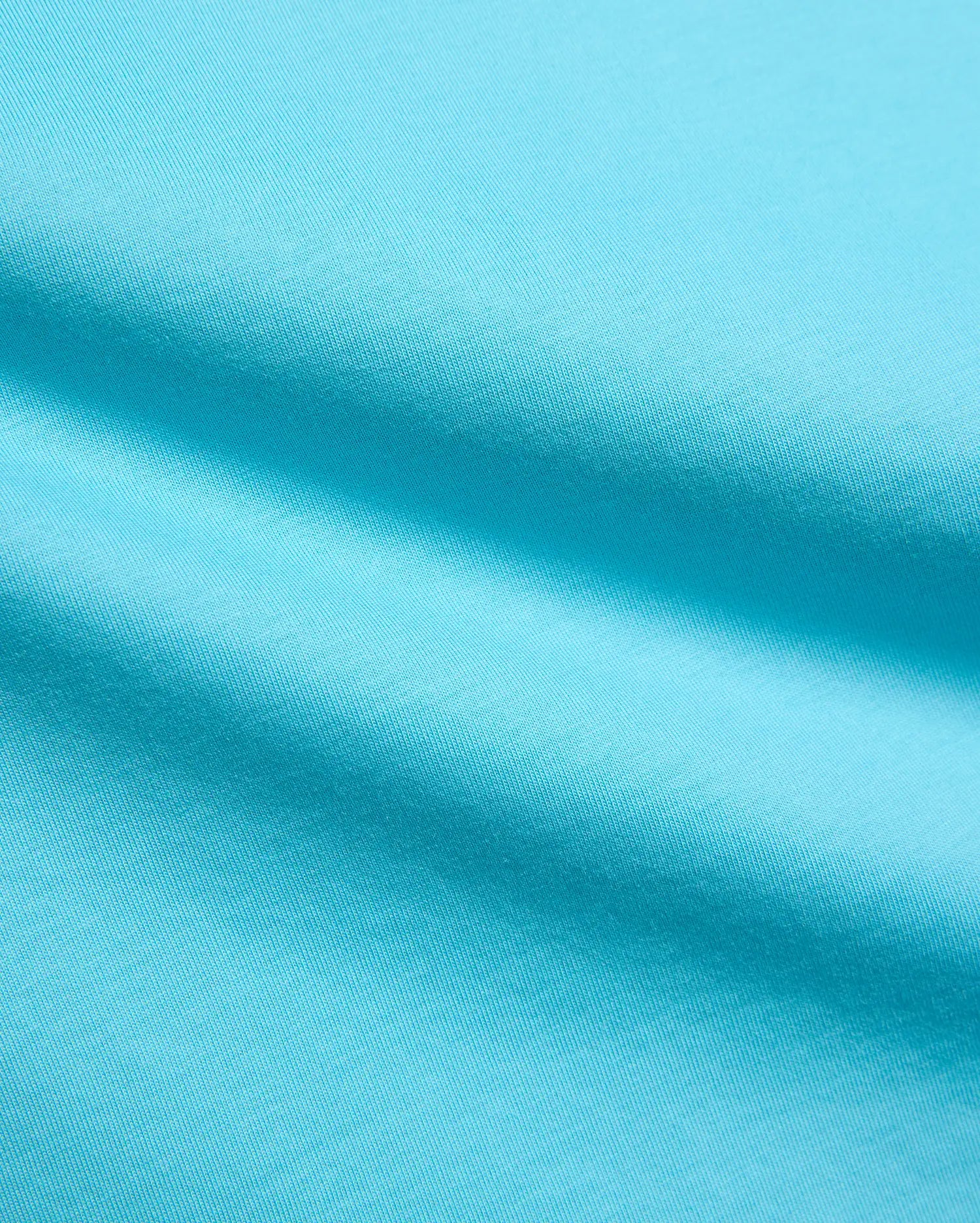 Kids Isaac Relaxed Fit Tee in vibrant aqua blue, crafted from soft jersey knit fabric, featuring the iconic small embroidered Psycho Bunny skull logo on the chest.