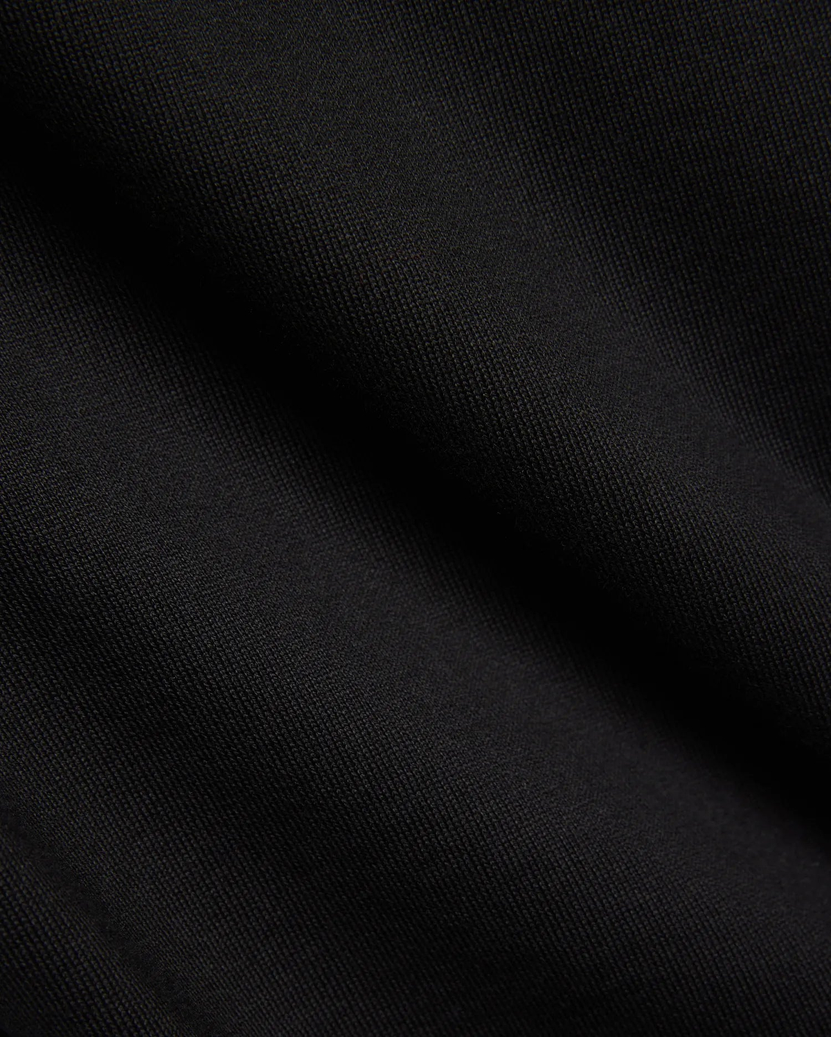 Kids Duncan Relaxed Fit Tee, a premium black jersey tee featuring a soft, finely woven texture, embodying Psycho Bunny's refined streetwear comfort.