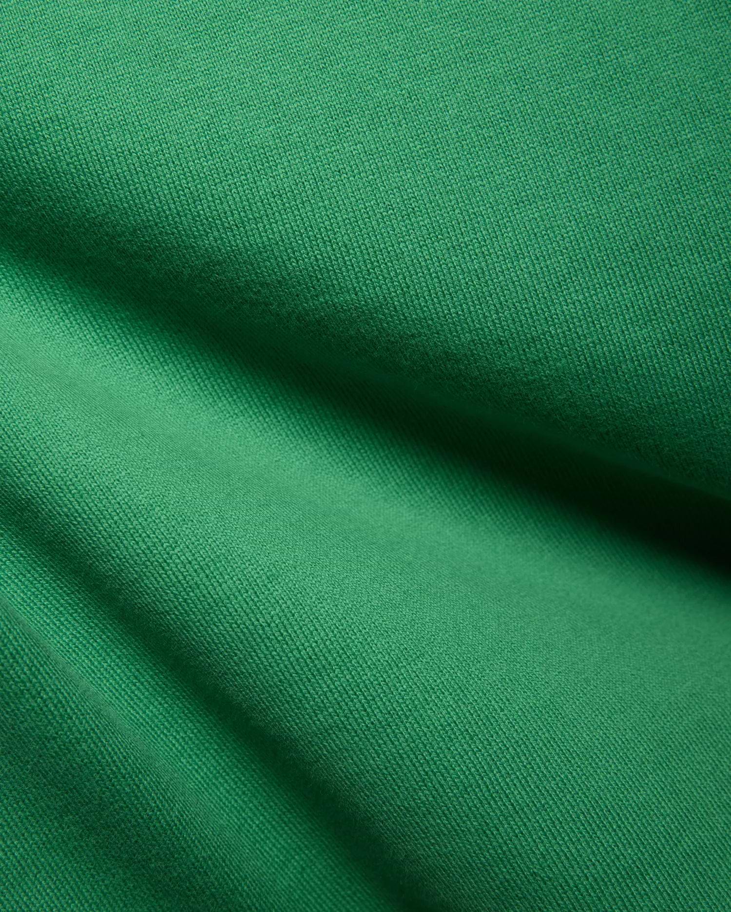 Psycho Bunny Kids Duncan Relaxed Fit Tee, vibrant emerald green jersey knit fabric with a soft, textured feel and subtle diagonal ribbing, showcasing premium quality for refined streetwear.