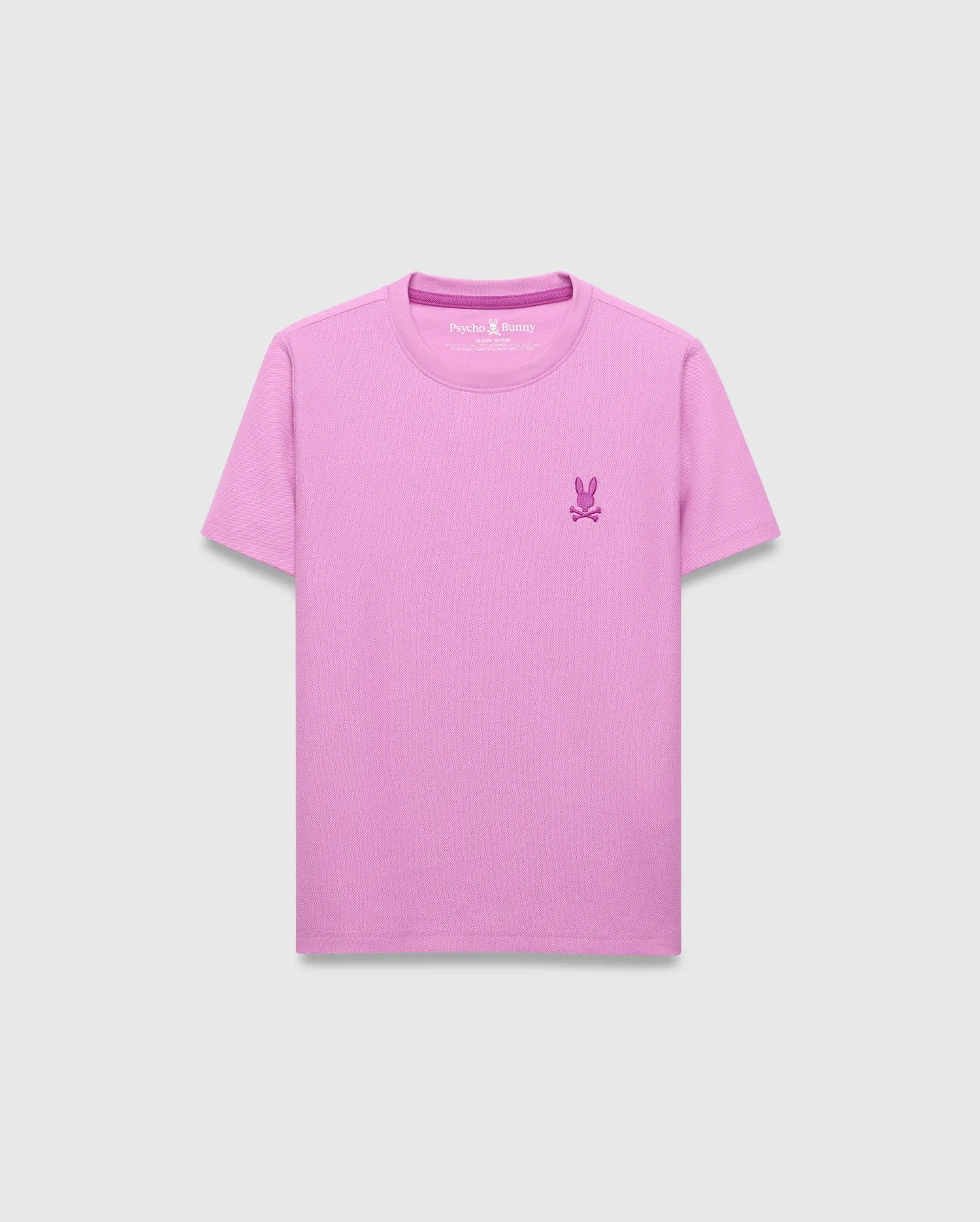 Kids Taylor Pique Tee in vibrant lavender pink, featuring a classic fit and pique texture. Small embroidered dark pink Psycho Bunny skull logo on the left chest, with a contrasting darker pink inner neck tape.