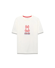 Kids Alex Relaxed Back Graphic Tee, an ecru jersey t-shirt with a relaxed fit, features a large central red and blue Psycho Bunny skull logo and repeated text graphic on the front, accented by a red inner collar.