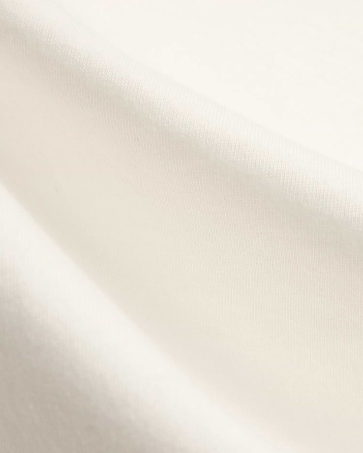 Kids Nathaniel Back Graphic Tee in premium cream jersey fabric, featuring a subtle knit texture and a distinctive Psycho Bunny skull logo graphic on the back.