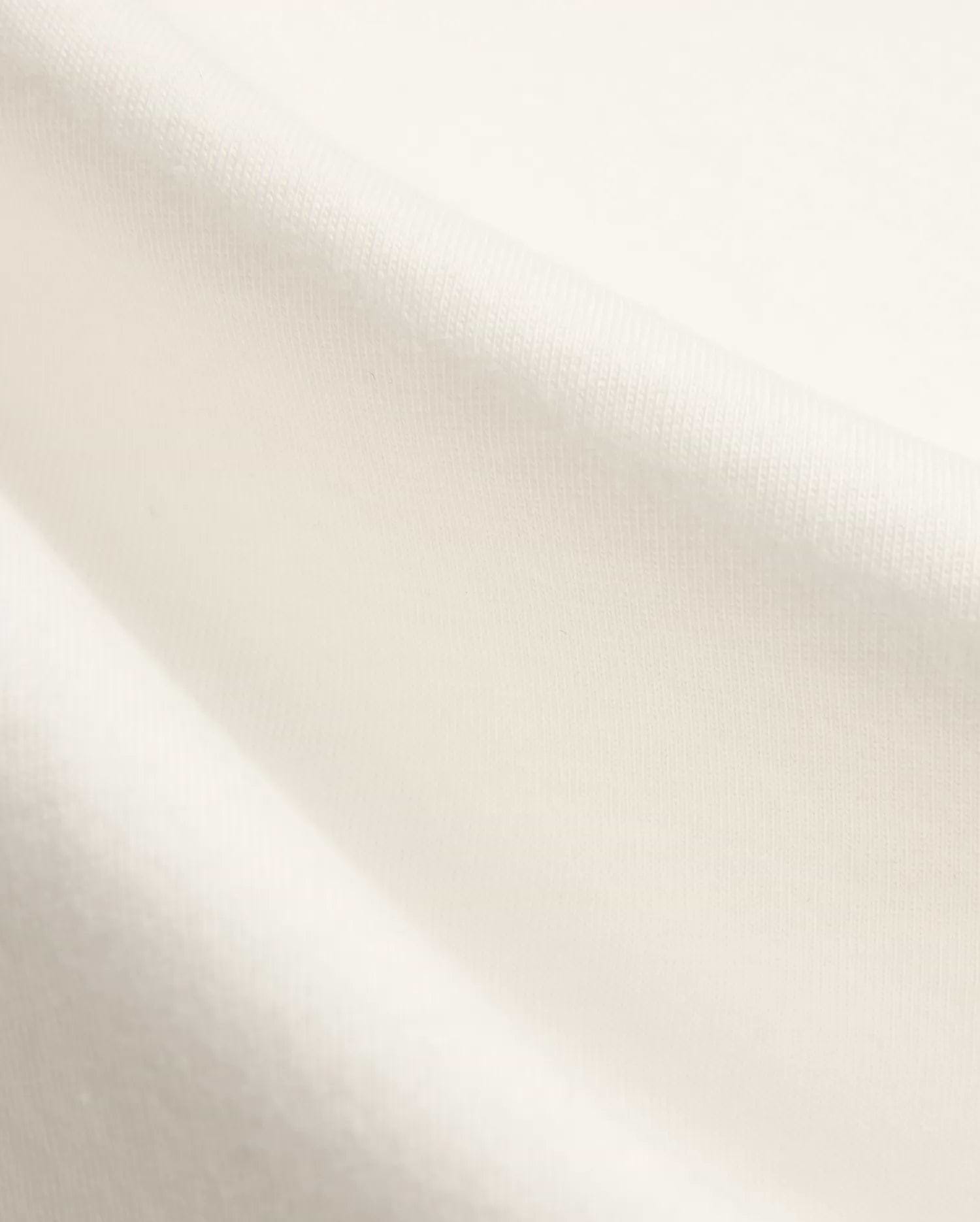 Kids Nathaniel Back Graphic Tee in premium cream jersey fabric, featuring a subtle knit texture and a distinctive Psycho Bunny skull logo graphic on the back.
