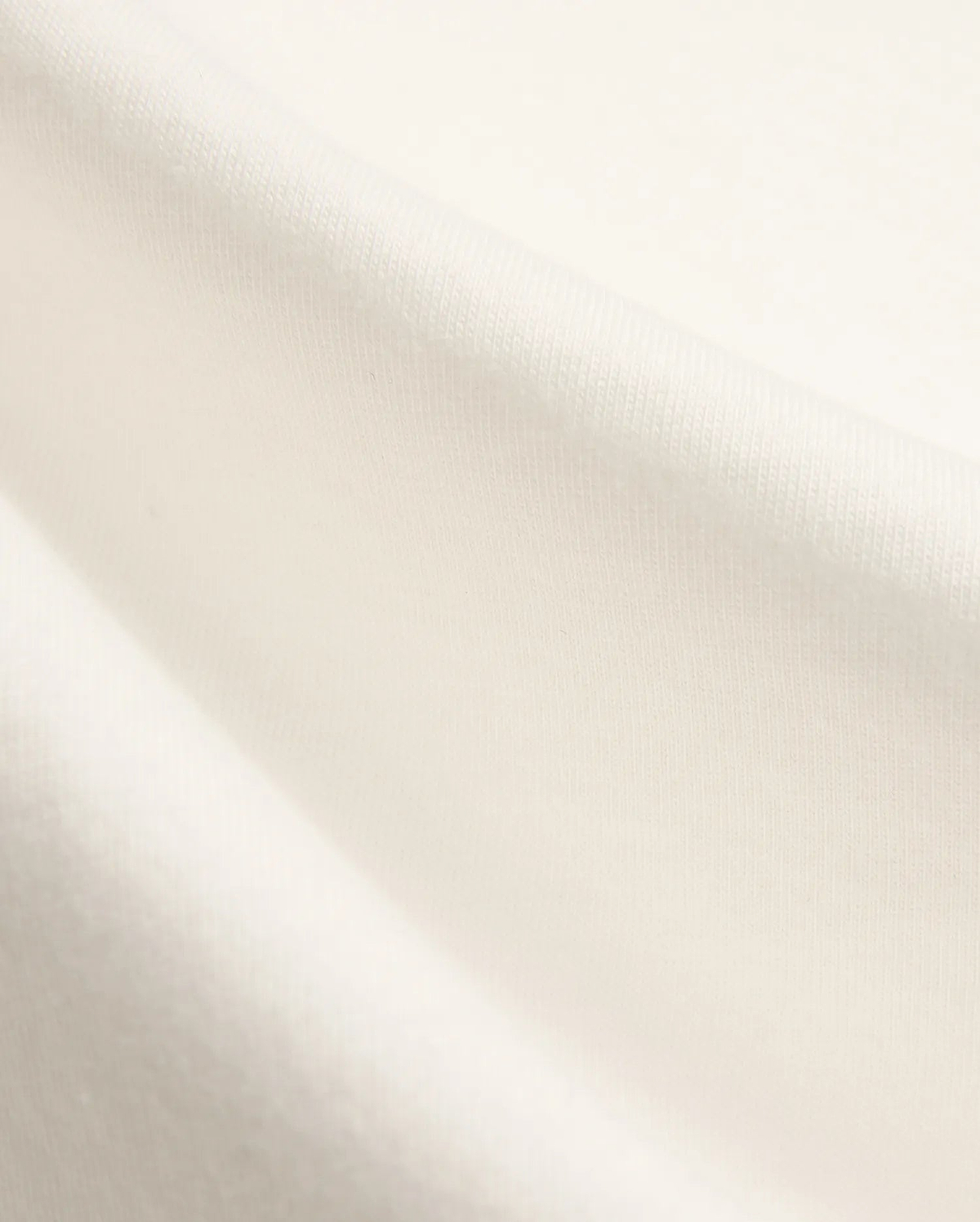 Kids Nathaniel Back Graphic Tee in premium cream jersey fabric, featuring a subtle knit texture and a distinctive Psycho Bunny skull logo graphic on the back.