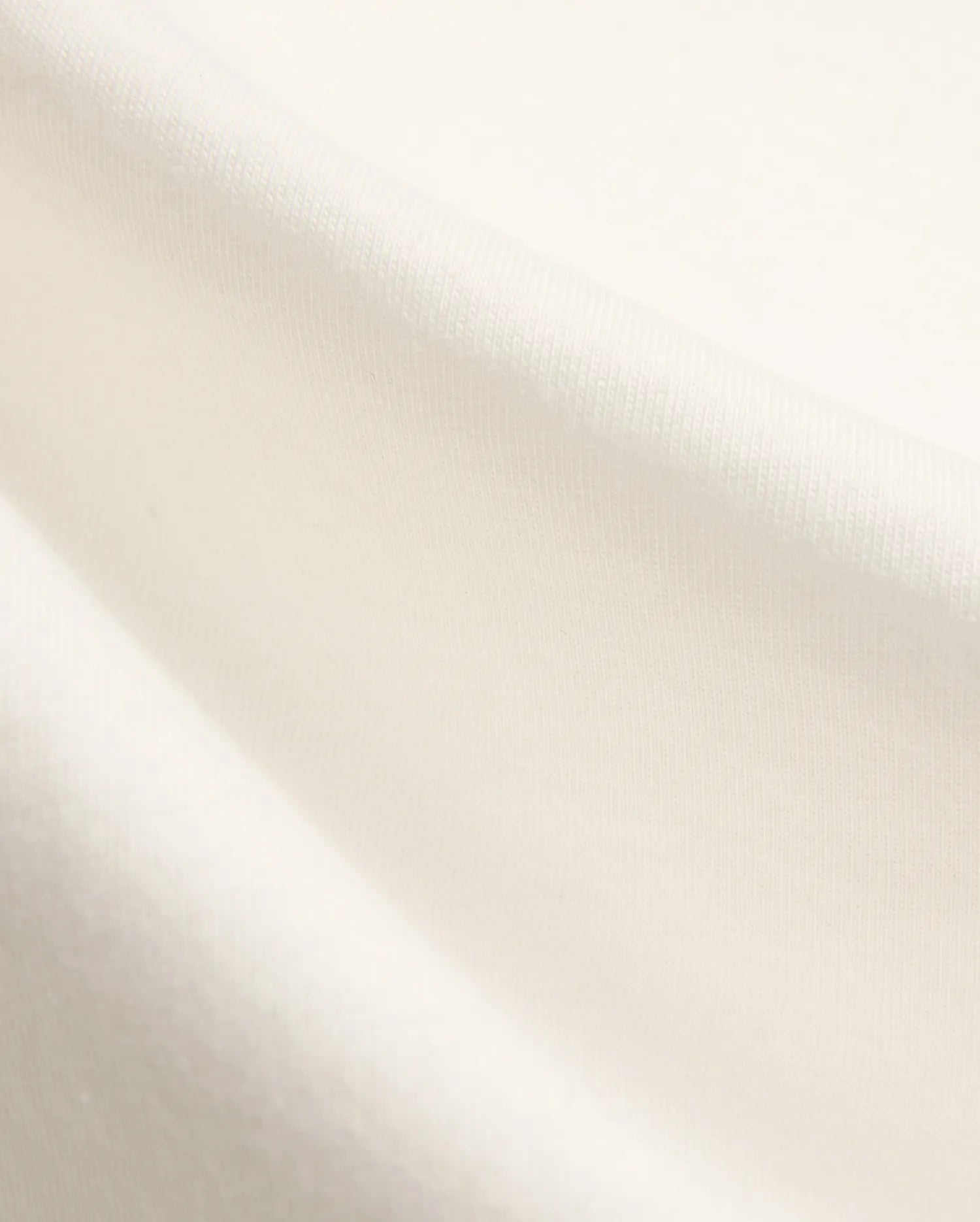 Kids Nathaniel Back Graphic Tee in premium cream jersey fabric, featuring a subtle knit texture and a distinctive Psycho Bunny skull logo graphic on the back.