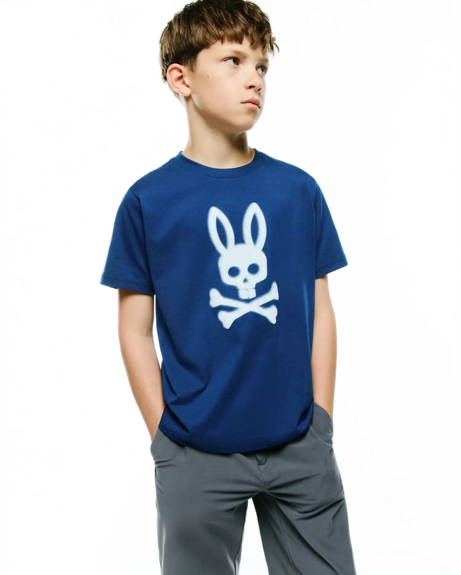 Kids Emmanuel Graphic Tee, a classic fit royal blue soft jersey t-shirt featuring a prominent white Psycho Bunny skull graphic print on the center chest.