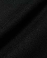 Premium black Kids Conan Back Graphic Tee, crafted from soft, finely ribbed jersey fabric, hinting at a bold back graphic for refined streetwear style.