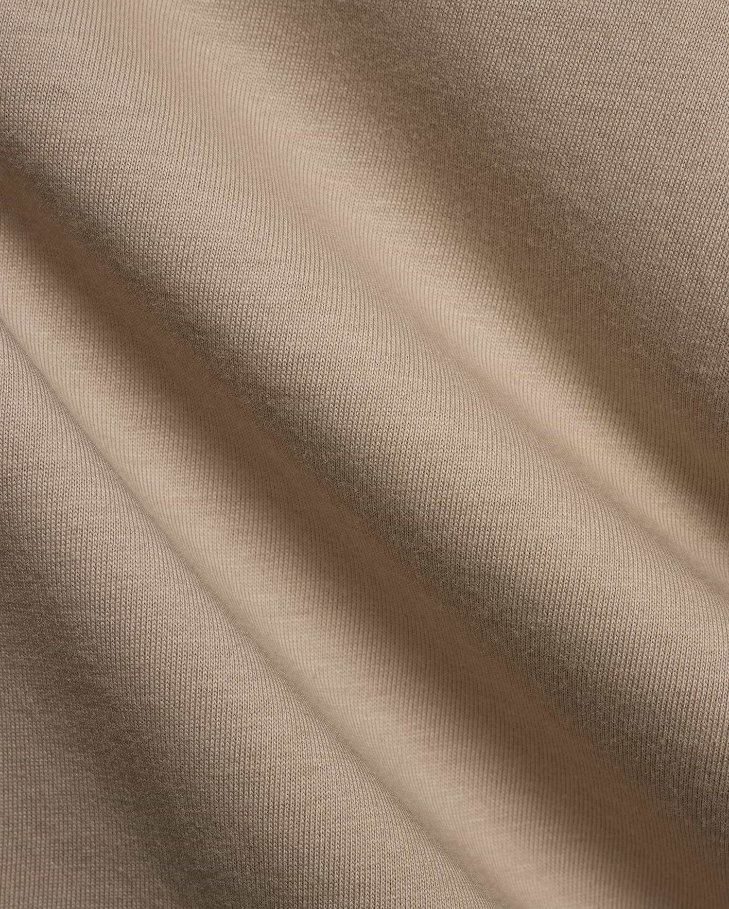 Kids Conan Back Graphic Tee in beige, crafted from soft jersey knit fabric with subtle texture, featuring a bold back graphic and signature Psycho Bunny branding.