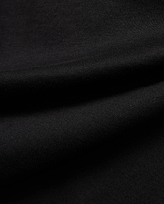 Premium black Kids Jaydon Wordmark Graphic Tee fabric, a soft, finely textured jersey knit with visible subtle ribbing and elegant draping folds, highlighting material quality.