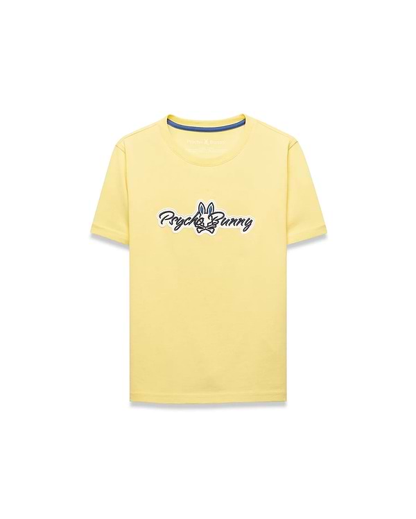 Kids Jaydon Wordmark Graphic Tee, a classic fit pale yellow jersey t-shirt featuring a large central chest graphic of the Psycho Bunny wordmark and skull logo in black, white, and blue.