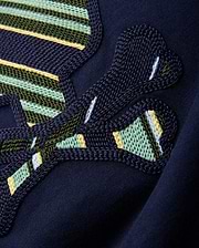 Kids Drew Embroidered Graphic Tee in classic navy jersey, showcasing a large, intricately textured graphic with bold green, yellow, light blue, and white striped embroidery.