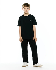 Kids Maxton Waffle Tee in black, a classic fit t-shirt with a subtle waffle texture, featuring a small white embroidered Psycho Bunny skull logo on the left chest.