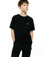 Kids Maxton Waffle Tee. Premium black classic fit waffle knit t-shirt featuring a small, crisp white embroidered Psycho Bunny skull and crossbones logo on the left chest, embodying refined streetwear style.