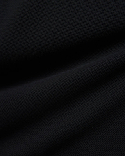 Premium Kids Maxton Waffle Tee in a deep black, featuring a distinct, soft waffle knit fabric texture with subtle raised squares and gentle folds, ensuring comfortable, refined style.