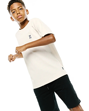 Kids Maxton Waffle Tee, a cream classic fit waffle knit t-shirt featuring a small embroidered dark blue Psycho Bunny skull logo on the left chest and a woven brand tag on the hem.