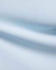 Kids Maxton Waffle Tee fabric in a soft sky blue, showcasing its distinctive raised waffle knit texture with subtle folds, ideal for comfortable, refined streetwear.