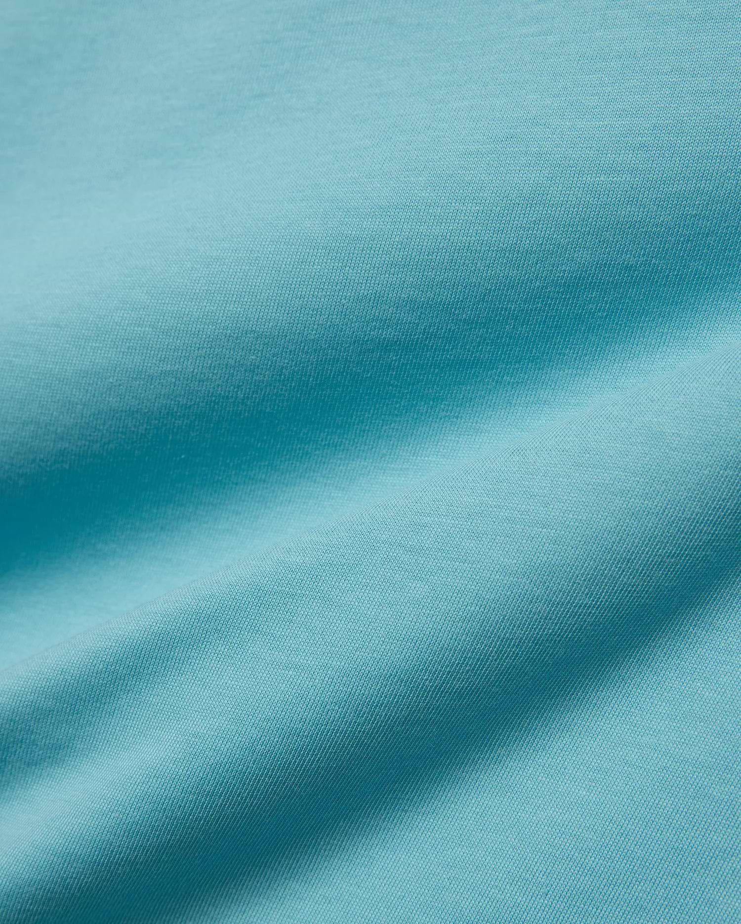 Kids' Alfie Back Graphic Tee in vibrant aqua blue, soft jersey knit fabric with subtle texture and flowing drapes, featuring a back graphic for a stylish, comfortable look. (5)