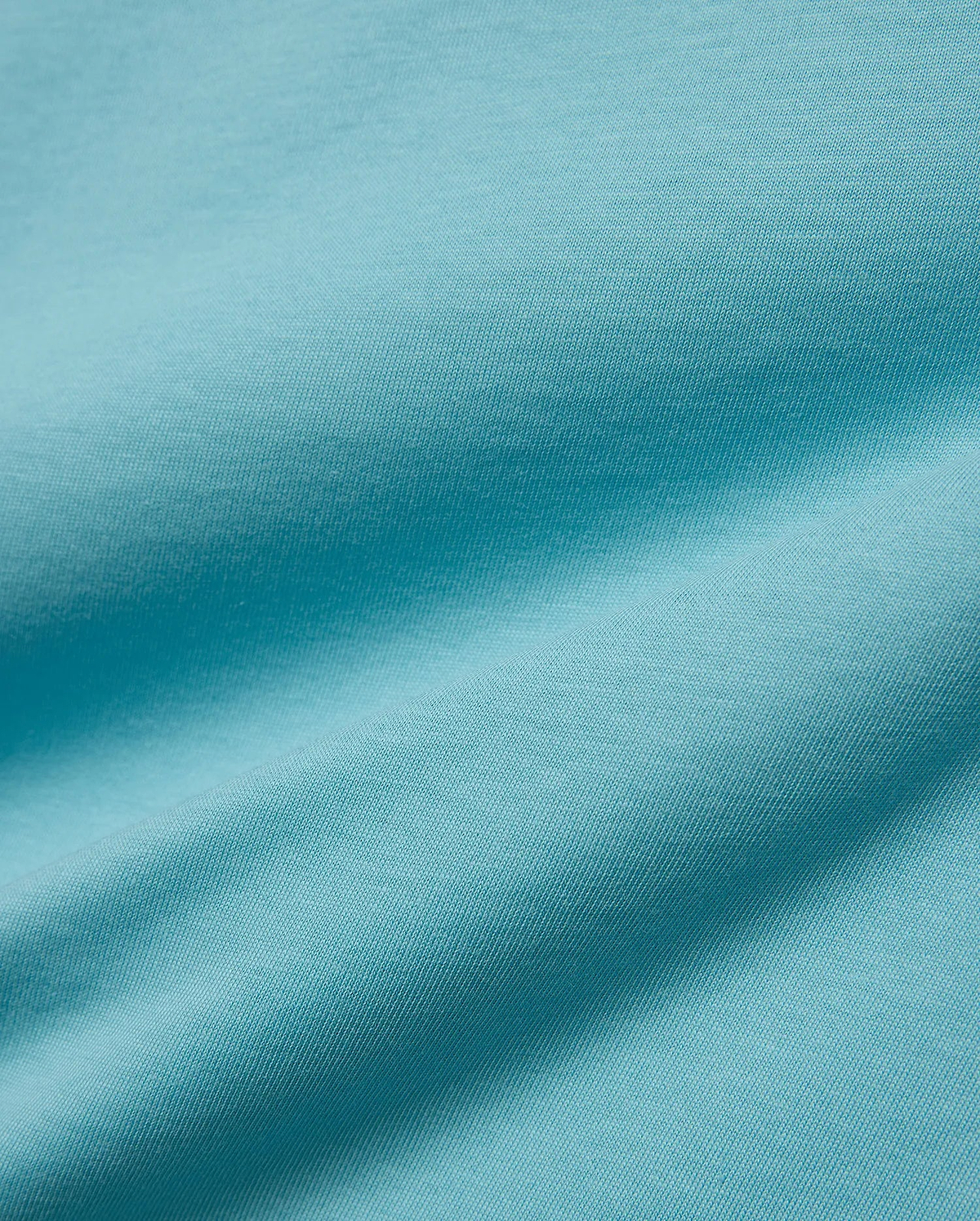 Kids' Alfie Back Graphic Tee in vibrant aqua blue, soft jersey knit fabric with subtle texture and flowing drapes, featuring a back graphic for a stylish, comfortable look. (5)
