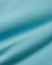 Kids' Alfie Back Graphic Tee in vibrant aqua blue, soft jersey knit fabric with subtle texture and flowing drapes, featuring a back graphic for a stylish, comfortable look. (5)