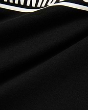 Kids' Raj Pima Graphic Tee, a premium black Pima cotton jersey knit with a soft texture, featuring a prominent, bold white graphic print, embodying refined streetwear style. (6)