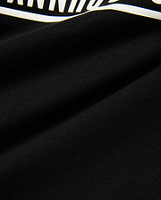 Kids' Raj Pima Graphic Tee, a premium black Pima cotton jersey knit with a soft texture, featuring a prominent, bold white graphic print, embodying refined streetwear style. (6)