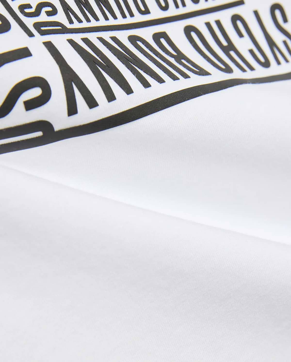 Kids' Raj Pima Graphic Tee in soft white Pima jersey knit, featuring a prominent, bold black PSYCHO BUNNY text graphic print, embodying premium streetwear style. (6)