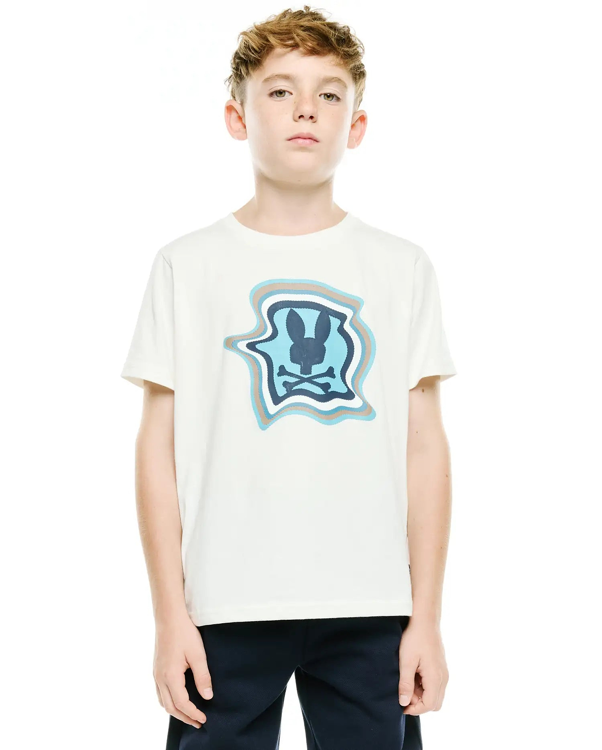 Kids' Klaus Pima Graphic Tee, a cream classic fit Pima cotton jersey t-shirt with a large center chest graphic featuring a wavy blue, light blue, and taupe border around a dark blue Psycho Bunny skull logo. (2)