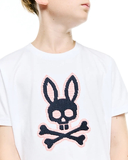 Kids' Samson Pima Graphic Tee. White jersey t-shirt featuring a large, central black and pink cross-stitch Psycho Bunny skull and crossbones logo, classic fit. (3)