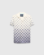 Kids Tobias Tencel Shirt in cream with a navy blue gradient diamond pattern featuring the Psycho Bunny skull logo, a relaxed fit, camp collar, and button-front.