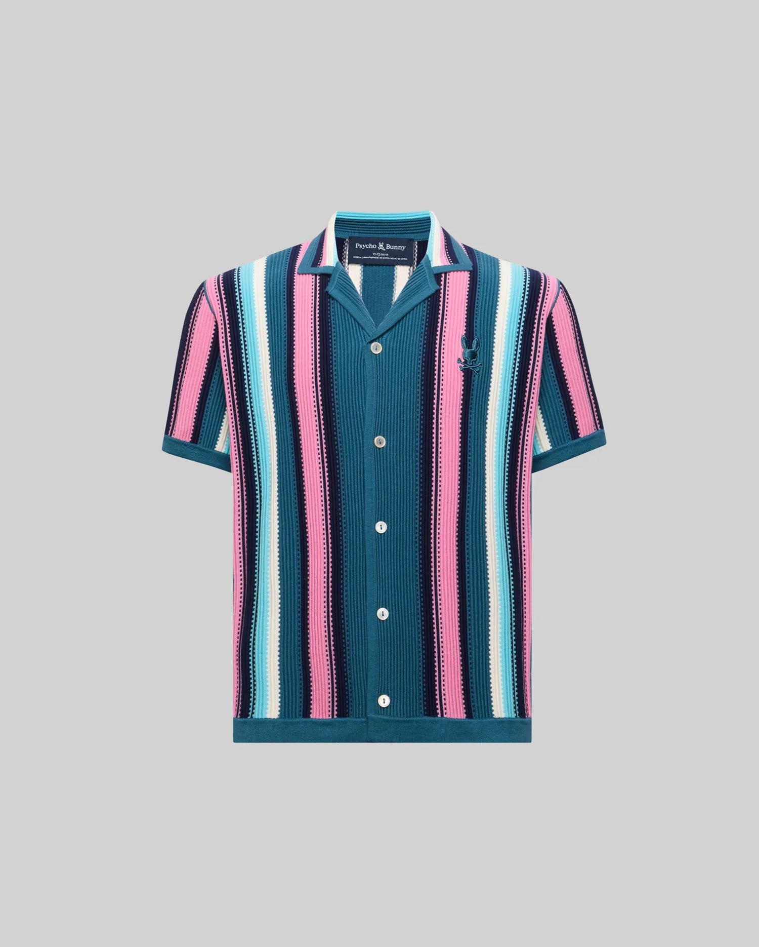 KIDS CLIFF KNIT SHIRT featuring a vibrant vertical stripe pattern in teal, pink, light blue, white, and navy, with a classic fit, knit texture, and small embroidered Psycho Bunny skull logo on the left chest.