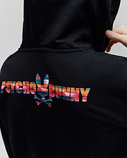 Kids Raphael French Terry Full Zip Hoodie in black, featuring a large, vibrant abstract multicolor Psycho Bunny text and bunny skull logo on the upper back, with a classic fit.