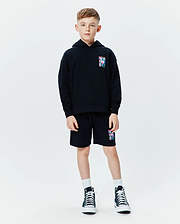 Black Kids Isaac Print Hoodie and matching shorts, relaxed fit french terry, featuring a small colorful Psycho Bunny skull logo print on the left chest and left thigh.