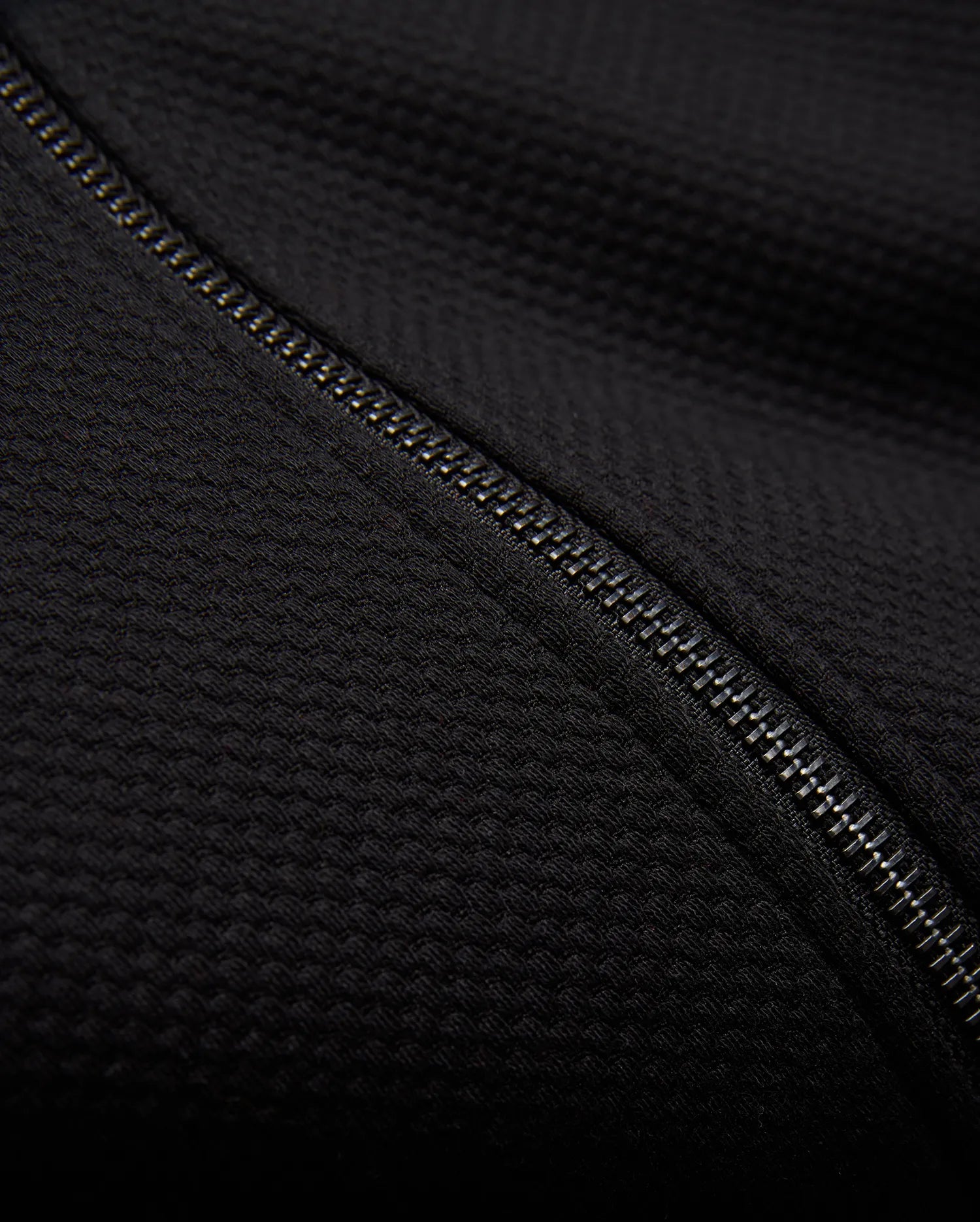 Kids Marc Textured Full Zip Hoodie in deep black, crafted from a refined textured knit fabric, featuring a prominent metallic silver full-zip closure.