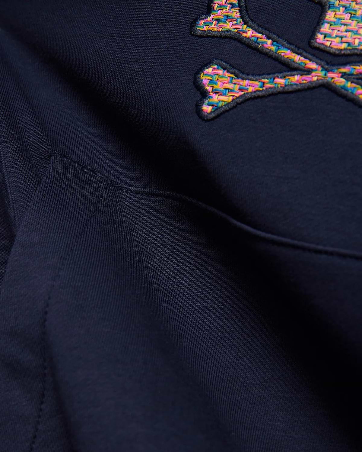 Kids Darcy Hoodie in deep navy blue, featuring a large, embroidered multicolored woven Psycho Bunny skull and crossbones logo and a front kangaroo pocket detail on soft knit fabric.